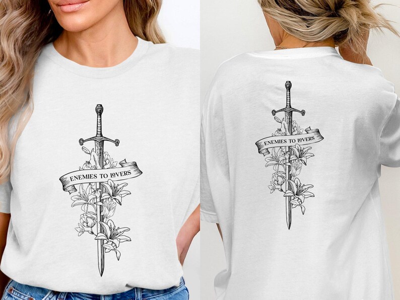 a woman wearing a t - shirt with a sword and flowers on it