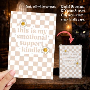 May include: A digital download for a Kindle case insert featuring a beige and white checkered pattern. The design includes the text "this is my emotional support kindle" with daisy accents. The image also shows the insert in a clear Kindle case.