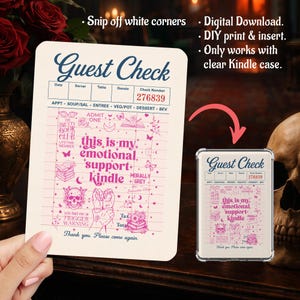 May include: A rectangular paper insert for a clear Kindle case featuring a vintage guest check design. The cream-colored card has blue text reading Guest Check and pink graphics including a skull, books, and the text this is my emotional support kindle.