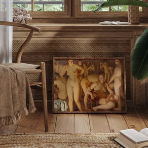 May include: A framed painting depicting nude figures in a warm, earthy palette. The artwork is displayed on a wooden floor, next to a wooden chair with a woven seat and a tan throw. The scene is set in a room with wooden paneling and a window.