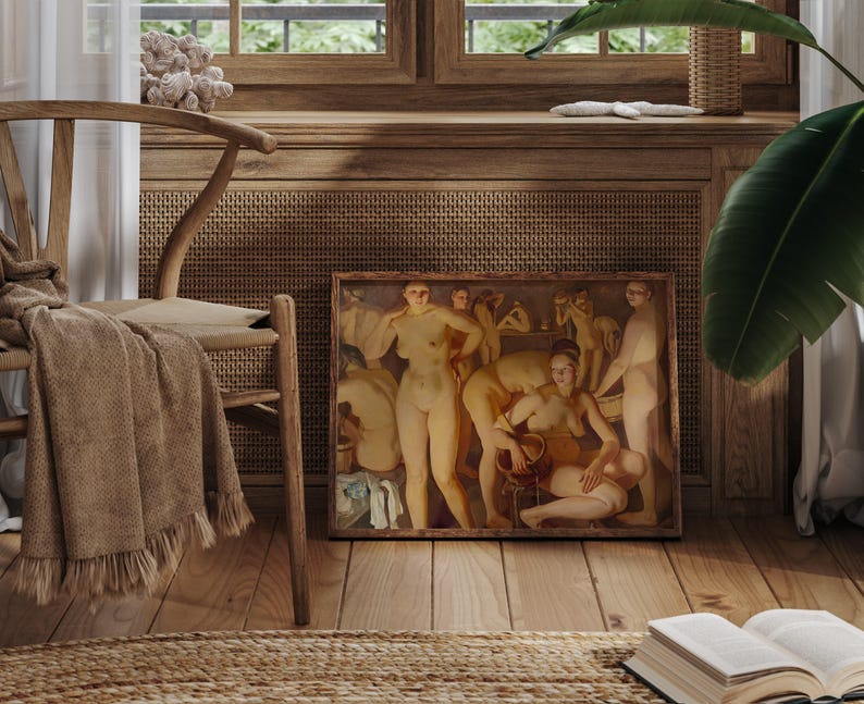 May include: A framed painting depicting nude figures in a warm, earthy palette. The artwork is displayed on a wooden floor, next to a wooden chair with a woven seat and a tan throw. The scene is set in a room with wooden paneling and a window.