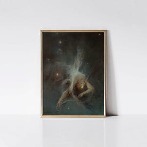 May include: A framed print featuring a classical painting of a figure in a celestial scene. The artwork depicts a nude figure with a glowing light, surrounded by stars and nebulas, set against a dark background. The frame is gold.