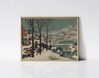 May include: A framed print of a winter landscape scene. The artwork depicts figures with dogs in a snowy environment, with buildings and mountains in the background. The print is in a gold-colored frame.