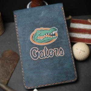 Custom Leather Scorecard Yardage book with custom laser engraving. Cigar Case and Bag Tag available.