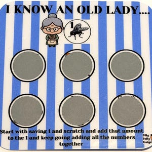 May include: A scratch card with a blue and white striped design. The text "I KNOW AN OLD LADY..." is at the top. It features an illustration of an elderly woman and a fly. The text "Start with saving 1..." is at the bottom.