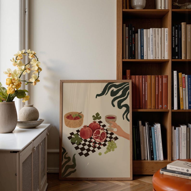 Portrait wooden frame mockups leaning against an oak bookcase in a cozy Scandinavian-style reading nook — soft natural window light, hardwood floor, decorative vases and orchids on a console; styled home decor and print mockups for listings.