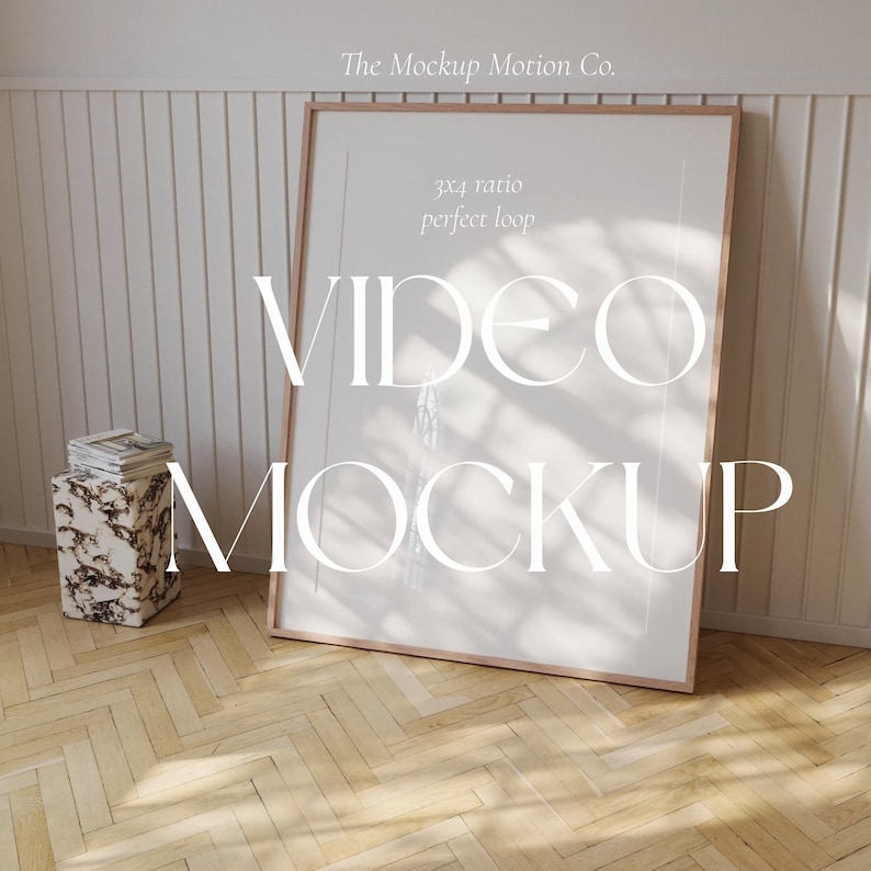 May include: A wooden frame with a white background and the text "VIDEO MOCKUP" in white letters. The text "3x4 ratio perfect loop" is also visible in the frame. The frame is sitting on a wooden floor with a white wall in the background.