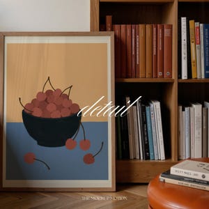 Portrait wooden frame mockups leaning against an oak bookcase in a cozy Scandinavian-style reading nook — soft natural window light, hardwood floor, decorative vases and orchids on a console; styled home decor and print mockups for listings.