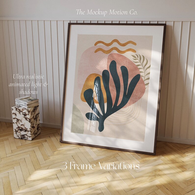 May include: A framed abstract art print with a blue, green, and pink design. The print is in a brown frame and is leaning against a white wall. The text "The Mockup Motion Co." and "3 Frame Variations" is visible below the frame.