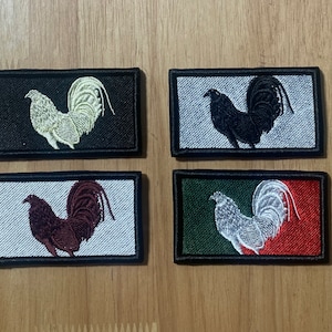 May include: Four embroidered patches featuring a rooster design. The patches are in different color combinations: black and white, white and black, white and red, and green and white.