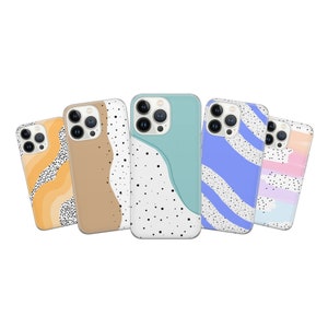 May include: Five different iPhone cases with abstract designs. The cases are all clear and have a white background. The designs are in various colours, including blue, pink, orange, and brown. The cases have a black polka dot pattern.