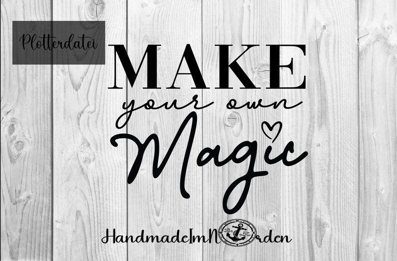May include: Black and white text graphic on a wood background that reads "MAKE your own Magic" with a small heart and an anchor symbol. The text "HandmadeMN" is also included.