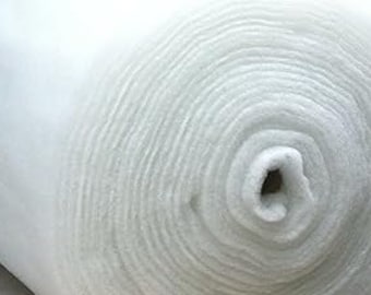 May include: A roll of white wadding, a soft, fluffy material used for quilting, crafts, and upholstery.