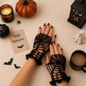 May include: A pair of black fingerless gloves featuring a crocheted spider web pattern. The gloves have a scalloped edge at the wrist and cover the back of the hand, leaving the fingers and thumb exposed for full dexterity while wearing.