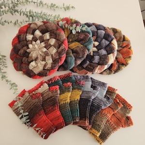 May include: A set of six colourful knitted hats with a braided pattern and a set of six colourful knitted fingerless gloves.