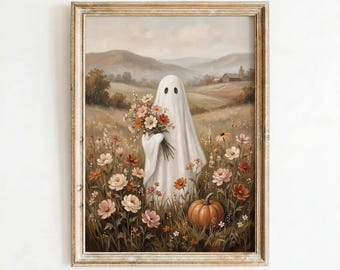 May include: A framed wall art print depicting a white ghost figure standing in a field of wildflowers and holding a bouquet of flowers, with a single orange pumpkin nearby and a landscape of rolling hills and a small house in the background.