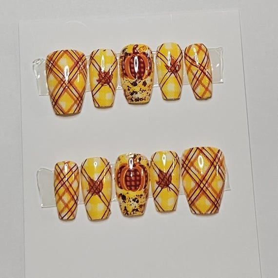 20 Thanksgiving Nail Ideas for a Festive Fall Manicure 11 Pumpkins in Yellow Plaid