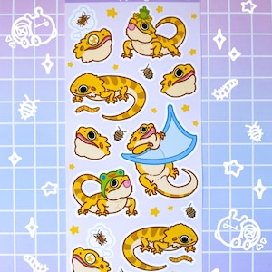 May include: A sheet of stickers featuring a variety of cartoon bearded dragons in different poses. The stickers are on a white background with a light purple border. The text "derpy dragon" is printed at the top of the sheet.