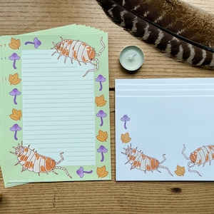 Papelería Isopod, tamaño A5, color naranja y crema, con temática de insectos del bosque, estilo cottagecore y kawaii.