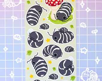 May include: A sheet of stickers featuring a variety of black and white isopods, or pill bugs, with red and white mushroom accents. The sheet is titled "isopod squad" and includes the text "snail mailery .com".