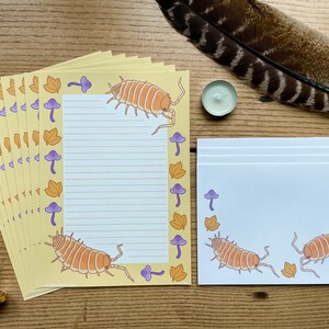 Papelería Isopod, tamaño A5, color naranja empolvado, con temática de insectos del bosque, estilo cottagecore kawaii.
