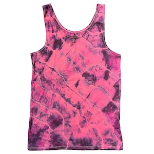 May include: A pink and purple tie-dye tank top. The tank top has a relaxed fit and a scoop neck.