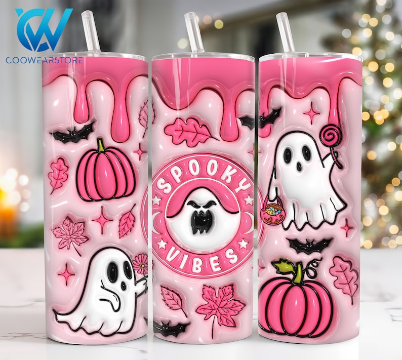 May include: Pink tumbler with a spooky vibes design. It features ghosts, pumpkins, bats, and leaves. The tumbler has a pink and white colour scheme.