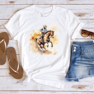 Cowboy auf Bucking Bronco Aquarell T-Shirt, Unisex Jersey Kurzarm T-Shirt, Bella & Canvas 3001 T-Shirt, T-Shirt, T-Shirt, hochwertiges Shirt