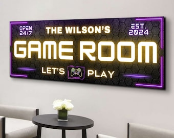 May include: A rectangular wall sign with a black honeycomb pattern background and glowing yellow and purple neon-style text. The sign reads THE WILSON'S GAME ROOM, OPEN 24/7, EST. 2024, and LET'S PLAY with a small graphic of a game controller.