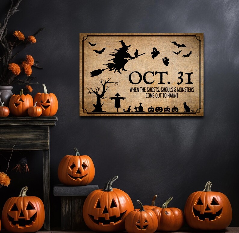 May include: A rectangular wall sign with a tan, weathered background featuring black silhouettes of a witch on a broom, bats, ghosts, a tree, a scarecrow, and pumpkins. The text reads: OCT. 31 WHEN THE GHOSTS, GHOULS & MONSTERS COME OUT TO HAUNT.