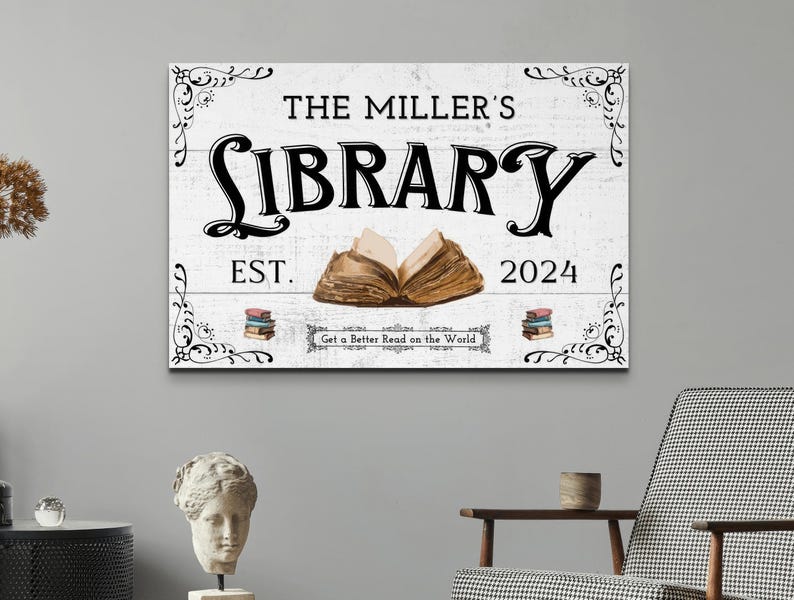 May include: White wooden sign with black text that reads "The Miller's Library Est. 2024 Get a Better Read on the World". The sign features a decorative border and an illustration of an open book.