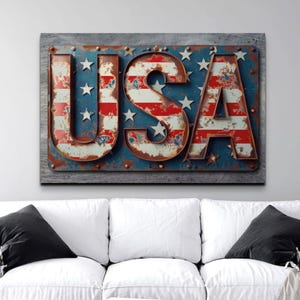 May include: A metal sign with the word "USA" in large, rusty letters. The letters are decorated with the American flag pattern in red, white, and blue.
