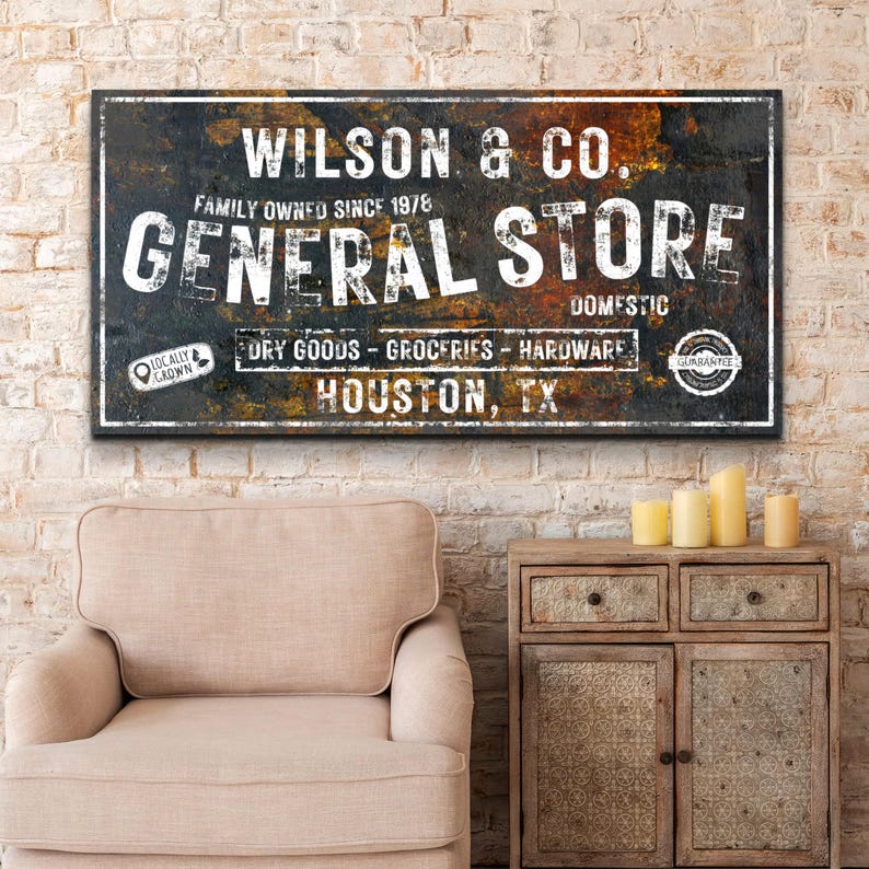 May include: A vintage-style sign for Wilson & Co. General Store, a family-owned business since 1978. The sign is made of distressed metal with a rusty brown and black color scheme. It features the text "Wilson & Co. General Store" in white lettering, along with the words "Family Owned Since 1978", "Domestic", "Dry Goods - Groceries - Hardware", "Locally Grown", and "Guarantee". The sign also includes the location "Houston, TX".