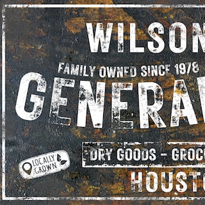 May include: A vintage-style metal sign with a distressed, rusty look. The sign reads "Wilson Family Owned Since 1978 General Dry Goods - Groceries Houston". The sign has a white background with black lettering and a green leaf logo that says "Locally Grown".