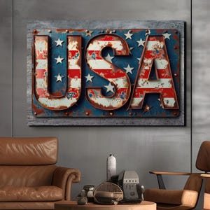 May include: A vintage-style metal sign with the word "USA" in large, bold letters. The letters are painted in red, white, and blue, resembling the American flag. The sign is weathered and rusty, giving it a distressed look.