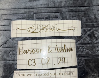 May include: A white card with gold lettering that says "Haroon & Aisha 03.02.24" and "And we created you in pairs" Quran (78:8).
