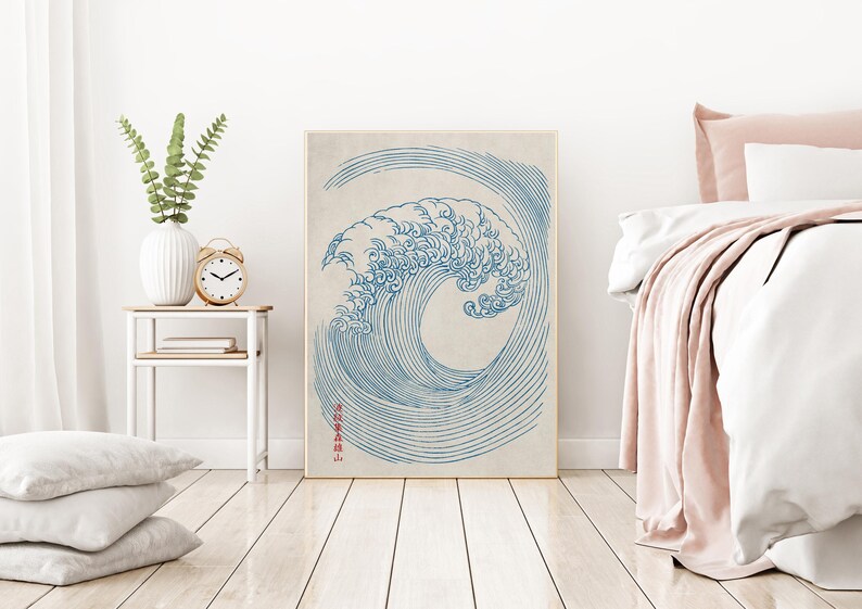 Puede incluir: Un dibujo en l&iacute;nea azul y blanco de una gran ola rompiendo, con el texto japon&eacute;s "神奈川沖浪裏" en rojo en el lado derecho de la imagen.