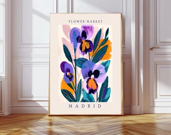 May include: A colorful abstract illustration of purple and blue flowers with green leaves and orange accents. The text "FLOWER MARKET MADRID" is at the top and bottom of the image.