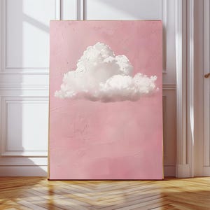 May include: A large rectangular canvas with a fluffy white cloud on a soft pink background. The artwork is indoors, leaning against a wall, with natural light. The painting creates a sense of calm. The canvas is approximately 100 cm x 70 cm.
