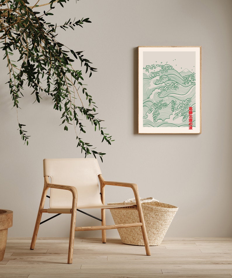 May include: A framed print of a green and white wave design with Japanese text that reads "波濤の宴". The print is hanging on a light gray wall with a wooden chair and a woven basket in the foreground.
