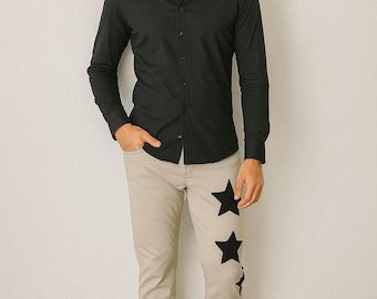 Vaqueros beige con estrellas negras