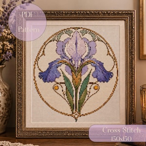 May include: A framed cross stitch pattern featuring a central iris flower in shades of purple, blue, and green, enclosed within a circular border. The design is set against a cream-colored fabric background. Text reads PDF Pattern and Cross Stitch 150x150.