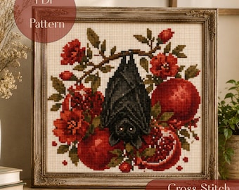 May include: A cross stitch pattern featuring a black bat hanging from a branch surrounded by red pomegranate fruits and flowers. The design is displayed in a decorative frame with the text PDF Pattern and Cross Stitch 100x100 visible.