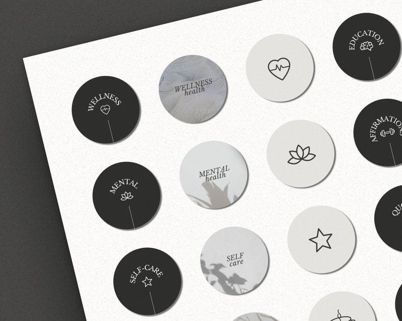 May include: A set of 12 black and white round stickers with various wellness-related icons and text. The icons include a heart with a heartbeat line, a lotus flower, a star, and a brain. The text includes "Wellness", "Wellness health", "Mental health", "Self care", "Education", "Affirmation", and "Quote".