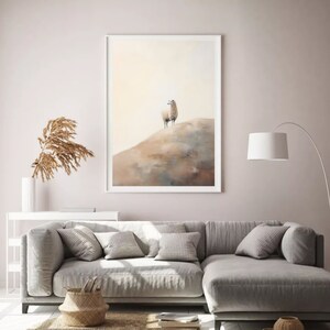 May include: A framed watercolour painting of a white llama standing on a brown hill. The background is a soft yellow.