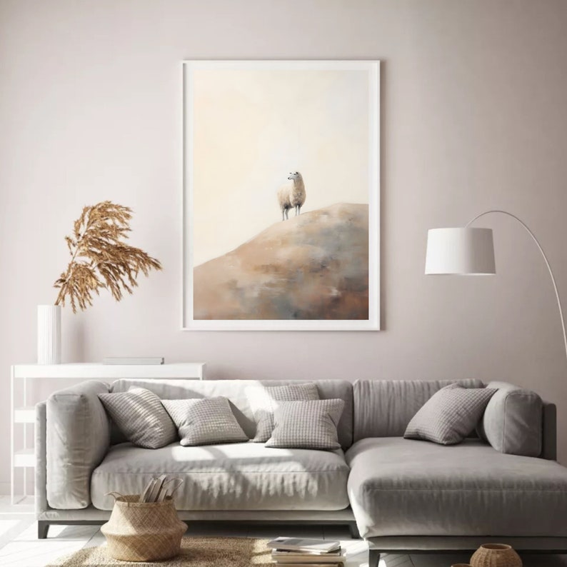 May include: A framed watercolour painting of a white llama standing on a brown hill. The background is a soft yellow.