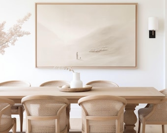 May include: A large rectangular wall art piece in a light wood frame featuring a minimalist beige landscape painting of a figure and a small animal in a vast desert. The artwork is displayed above a light oak dining table with cane back chairs.