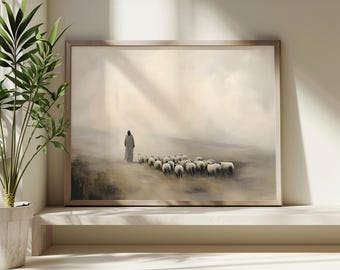 May include: A painting of a person in a white robe walking in front of a flock of sheep. The scene is set in a field with a misty background. The painting is framed in a light wood frame.