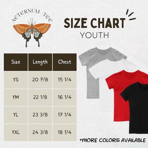 May include: Size chart for youth t-shirts. The chart shows measurements for sizes YS, YM, YL, and YXL. Length measurements range from 20 7/8 to 24 3/8 inches, and chest measurements range from 15 1/4 to 18 1/4 inches. The image also displays gray, white, red, and black t-shirts.
