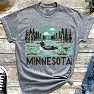 Minnesota Lake and Loon T-Shirt, Nature Inspired Tee, Wildlife Gift Shirt, Minnesota Souvenir, Outdoor Adventure, Unisex Heavy Cotton Tee